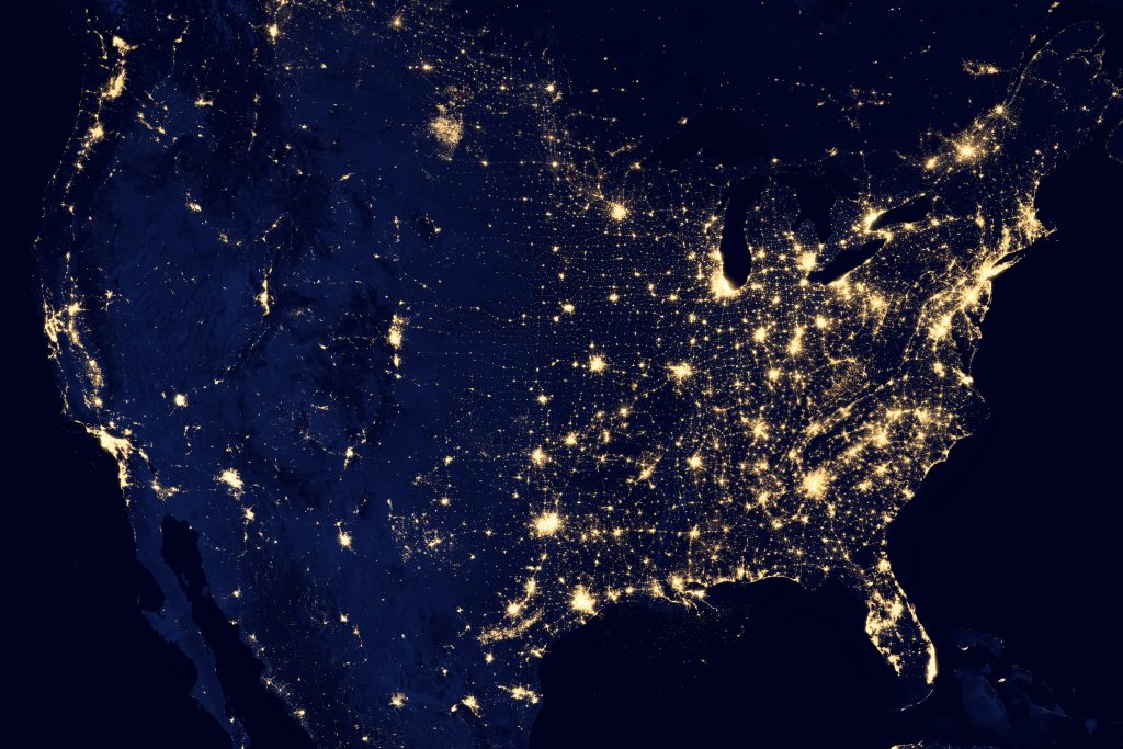 NASA image acquired April 18 - October 23, 2012 This image of the United States of America at night is a composite assembled from data acquired by the Suomi NPP satellite in April and October 2012. The image was made possible by the new satellite’s “day-night band” of the Visible Infrared Imaging Radiometer Suite (VIIRS), which detects light in a range of wavelengths from green to near-infrared and uses filtering techniques to observe dim signals such as city lights, gas flares, auroras, wildfires, and reflected moonlight. “Nighttime light is the most interesting data that I’ve had a chance to work with,” says Chris Elvidge, who leads the Earth Observation Group at NOAA’s National Geophysical Data Center. “I’m always amazed at what city light images show us about human activity.” His research group has been approached by scientists seeking to model the distribution of carbon dioxide emissions from fossil fuels and to monitor the activity of commercial fishing fleets. Biologists have examined how urban growth has fragmented animal habitat. Elvidge even learned once of a study of dictatorships in various parts of the world and how nighttime lights had a tendency to expand in the dictator’s hometown or province. Named for satellite meteorology pioneer Verner Suomi, NPP flies over any given point on Earth's surface twice each day at roughly 1:30 a.m. and p.m. The polar-orbiting satellite flies 824 kilometers (512 miles) above the surface, sending its data once per orbit to a ground station in Svalbard, Norway, and continuously to local direct broadcast users distributed around the world. Suomi NPP is managed by NASA with operational support from NOAA and its Joint Polar Satellite System, which manages the satellite's ground system. NASA Earth Observatory image by Robert Simmon, using Suomi NPP VIIRS data provided courtesy of Chris Elvidge (NOAA National Geophysical Data Center). Suomi NPP is the result of a partnership between NASA, NOAA, and t